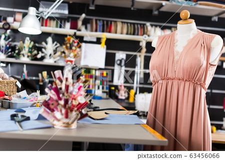 Workplace with mannequin with dress in sewing shop of clothes factory 63456066
