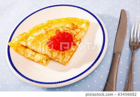 Crepes with red caviar 63456082