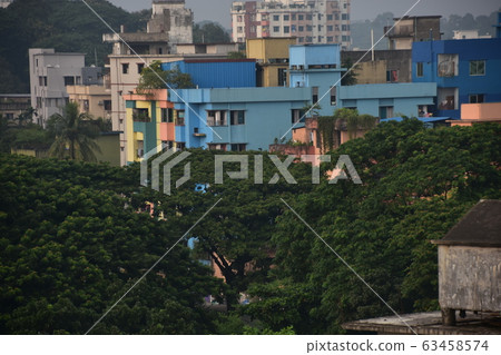 Cityscape of Chittagong, Bangladesh New condominium and building under construction Lush forest 63458574