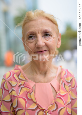 Beautiful senior tourist woman with blond hair relaxing around t Beautiful senior tourist woman with blond hair relaxing around t 63458977