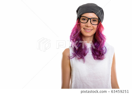 Studio shot of young happy woman smiling while wearing eyeglasse 63459251