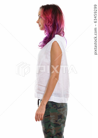 Profile view of young beautiful woman standing Profile view of young beautiful woman standing 63459299
