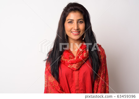 Face of happy young Persian woman smiling in traditional clothing Face of happy young Persian woman smiling in traditional clothing 63459396