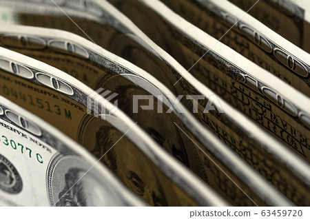 Paper dollar bills are standing next to each other Paper dollar bills are standing next to each other 63459720
