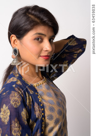 Face of young beautiful Persian woman in traditional clothing Face of young beautiful Persian woman in traditional clothing 63459838