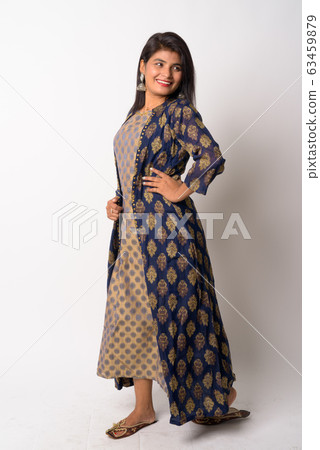 Full body shot of happy young Persian woman looking back in traditional clothing Full body shot of happy young Persian woman looking back in traditional clothing 63459879