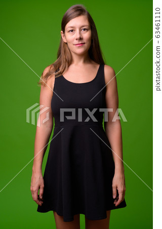 Young beautiful woman wearing black dress 63461110