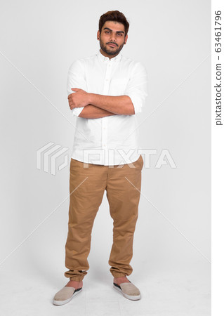 Full body shot of young handsome bearded Indian man with arms crossed Full body shot of young handsome bearded Indian man with arms crossed 63461796