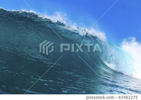 Ocean wave under blue sky 63462275