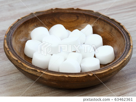 Pile of softener salt pellets in the bowl Pile of softener salt pellets in the bowl 63462361