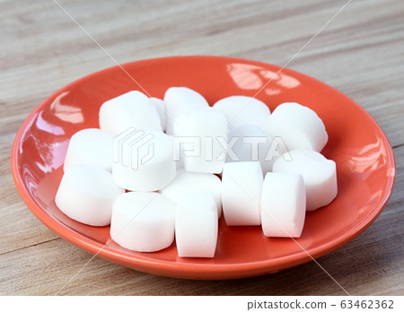 Pile of softener salt pellets in the bowl Pile of softener salt pellets in the bowl 63462362