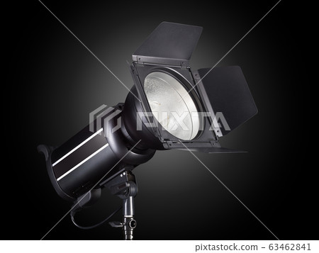 Photography studio flash isolated on black background with lamp. Photography studio flash isolated on black background with lamp. 63462841