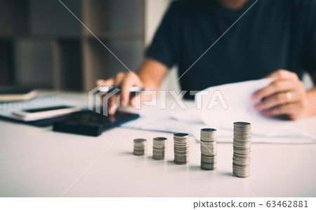 Asian men are calculating about finances about the Asian men are calculating about finances about the 63462881