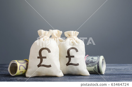 Pound sterling money bags. Capital investment, savings. Economics, lending business. Banking service, monetary policy. Reserve currency. Profit income, dividends. Crowdfunding startups investing. Pound sterling money bags. Capital investment, savings. Economics, lending business. Banking service, monetary policy. Reserve currency. Profit income, dividends. Crowdfunding startups investing. 63464724