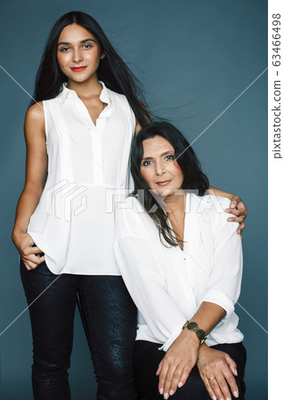 cute pretty teen daughter with mature mother hugging, fashion style brunette, lifestyle people concept cute pretty teen daughter with mature mother hugging, fashion style brunette, lifestyle people concept 63466498