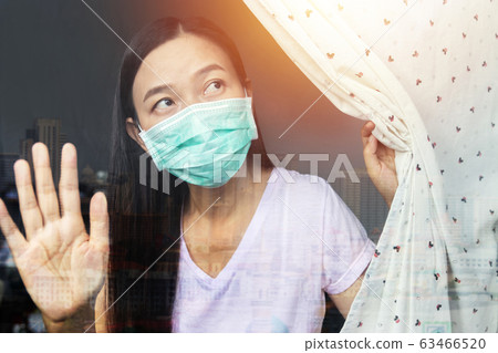 home quarantine concept. woman at risk of being infected with the Coronavirus stay isolation at home for self quarantine, prevention spreading of germs during COVID-19 Coronavirus outbreak situation home quarantine concept. woman at risk of being infected with the Coronavirus stay isolation at home for self quarantine, prevention spreading of germs during COVID-19 Coronavirus outbreak situation 63466520