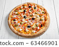 Fresh italian vegetarian pizza on wooden table 63466901