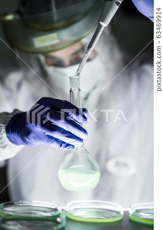 Scientist working in corona virus vaccine development laboratory research facility. 63469914