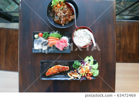 raw salmon and raw tuna or sashimi and grilled 63472469