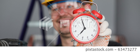 Happy enthusiastic construction worker 63473277