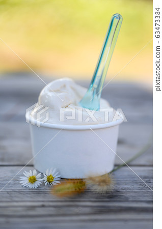Tofu Gelato ice cream in paper cup on table Tofu Gelato ice cream in paper cup on table 63473384