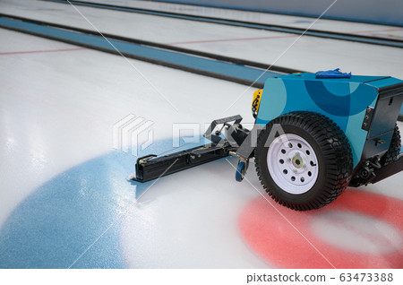 Cleaner sweeper machine on ice field 63473388