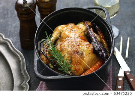 Roast chicken in Dutch oven Roast chicken in Dutch oven 63475220