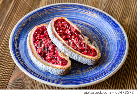 Slices of cherry strudel 63478578