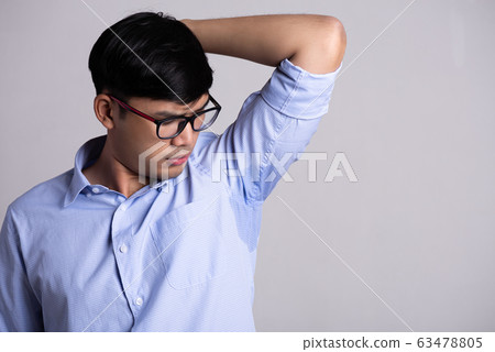 Close up asian man with hyperhidrosis sweating. Close up asian man with hyperhidrosis sweating. 63478805