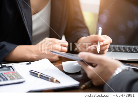 Two young businessman and businesswoman Two young businessman and businesswoman 63478991