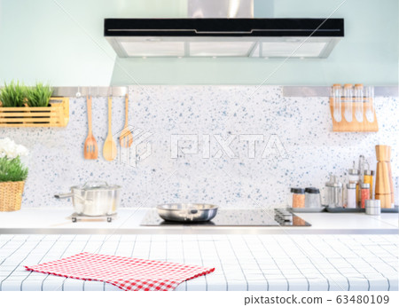Wood table top on blurred kitchen background Wood table top on blurred kitchen background 63480109