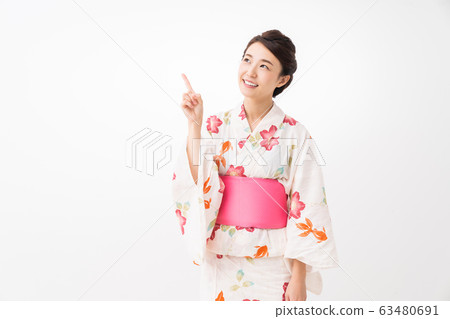 A woman in a yukata A woman in a yukata 63480691