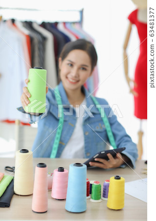 Designer happy with her started a new collection.. Designer happy with her started a new collection.. 63481377