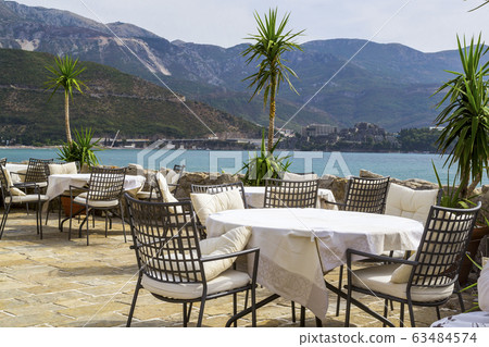 Restaurant in the open air near the sea. Tables Restaurant in the open air near the sea. Tables 63484574