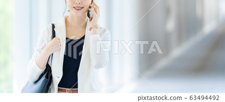 Business woman making phone call Business image Female employee Business woman making phone call Business image Female employee 63494492