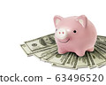 happy piggy bank on dollar bills isolated on white background 63496520