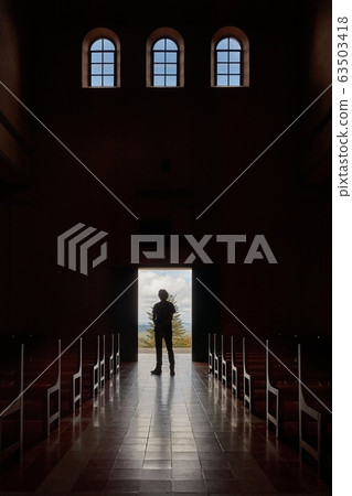 Standing in the church door Standing in the church door 63503418