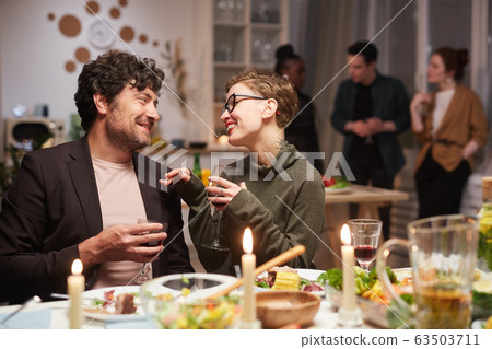 Young couple talking at the party 63503711