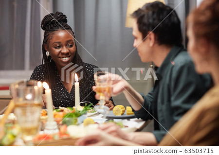 African woman at the holiday table African woman at the holiday table 63503715