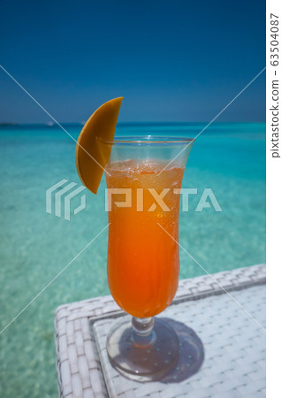 exotic summer drinks with ice in tropical paradise, picture of refreshing drinks 63504087