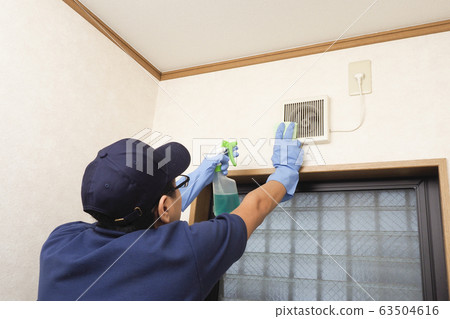House cleaning male worker cleaning toilet ventilation fan House cleaning male worker cleaning toilet ventilation fan 63504616