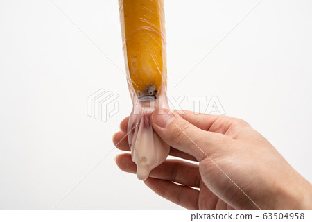 Condom, banana and yogurt image after ejaculation Condom, banana and yogurt image after ejaculation 63504958