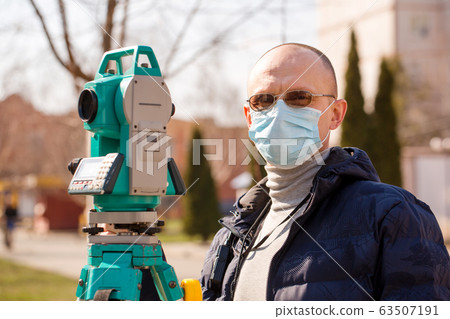 Surveyor in a protective mask, Coronavirus Surveyor in a protective mask, Coronavirus 63507191