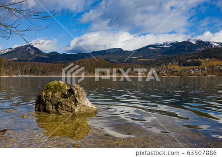 View idyllic Alpine mountains and lake 63507886