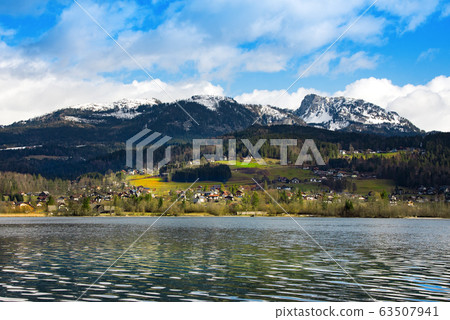 View idyllic Alpine mountains and lake View idyllic Alpine mountains and lake 63507941