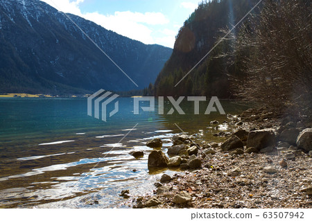 View idyllic Alpine mountains and lake View idyllic Alpine mountains and lake 63507942