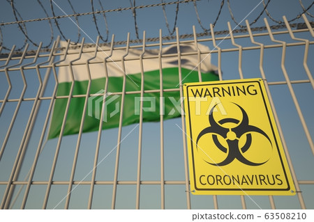 Biohazard coronavirus sign on the barbed wire fence near flag of Saxony, a state of Germany. COVID-19 quarantine related 3D rendering 63508210
