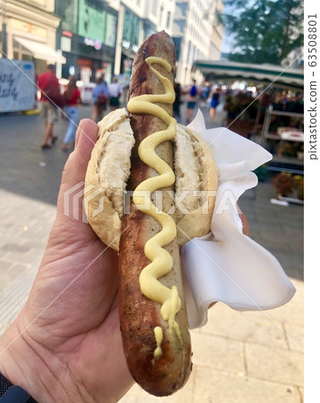 German cuisine - grilled sausage (bratwurst) in a bread roll German cuisine - grilled sausage (bratwurst) in a bread roll 63508801