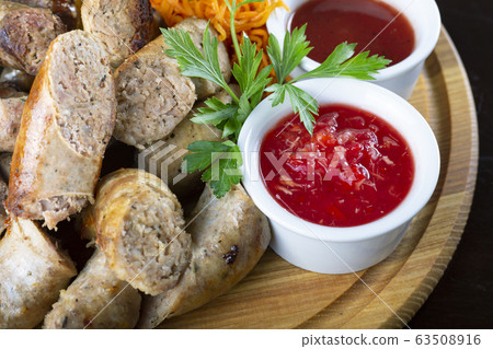 Homemade grilled sausages with sauerkraut and 63508916