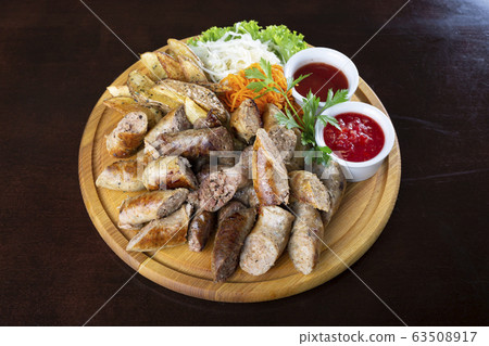 Homemade grilled sausages with sauerkraut and 63508917